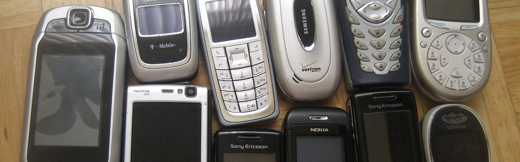 Handsets from half a dozen manufacturers, laid out in rows.