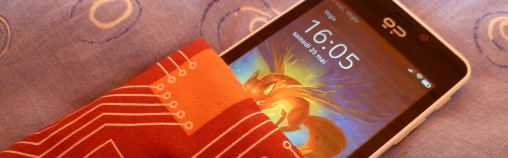 A handset resting on a printed circuit-board pattern.