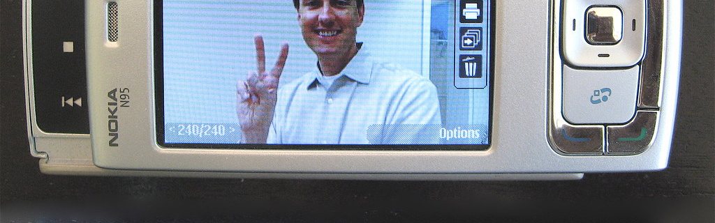 A Nokia N95 with the camera view open on its screen.