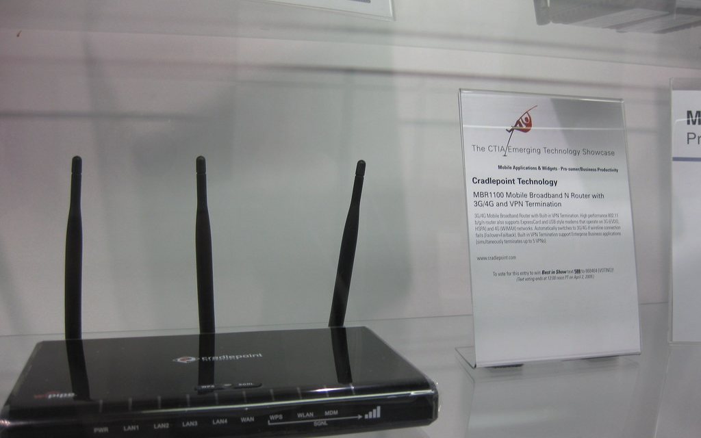 A multi-band router in a display case, labelled with the bands it speaks.